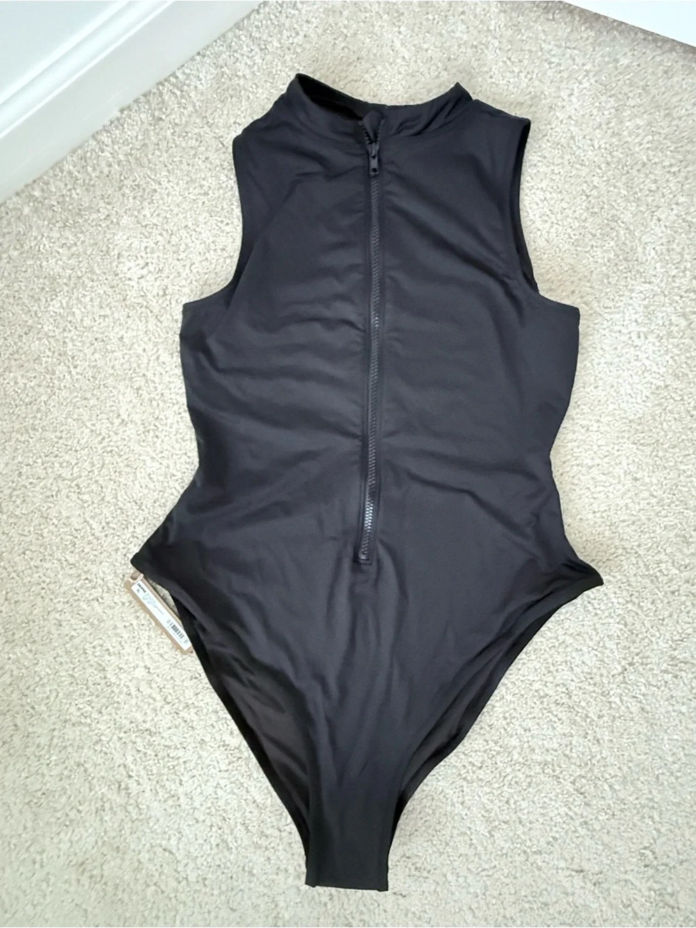 SKIMS Sleeveless Black Zip-Front Swimsuit in Color Onyx